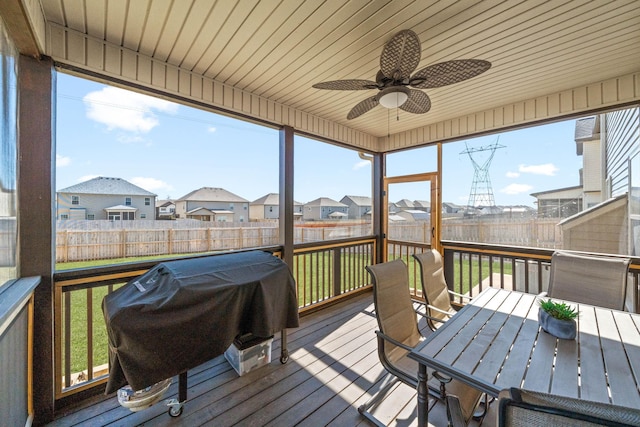 exterior space featuring fence private yard, outdoor dining area, a ceiling fan, and area for grilling