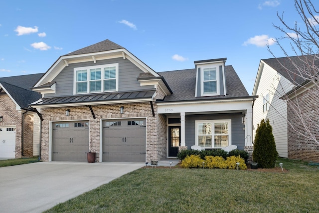 craftsman house featuring a standing seam roof, driveway, brick siding, and a front lawn