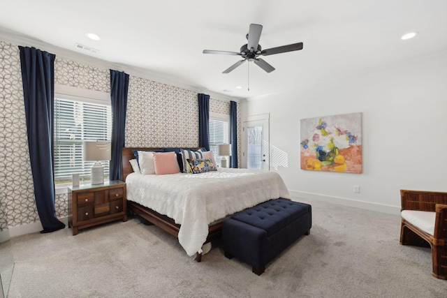 carpeted bedroom featuring multiple windows, recessed lighting, visible vents, and baseboards