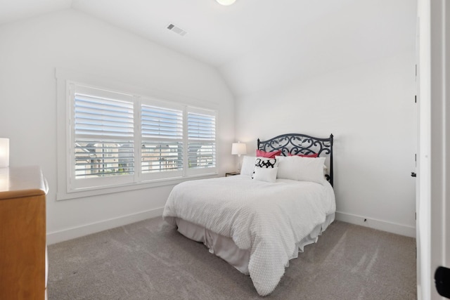 bedroom with carpet, visible vents, lofted ceiling, and baseboards