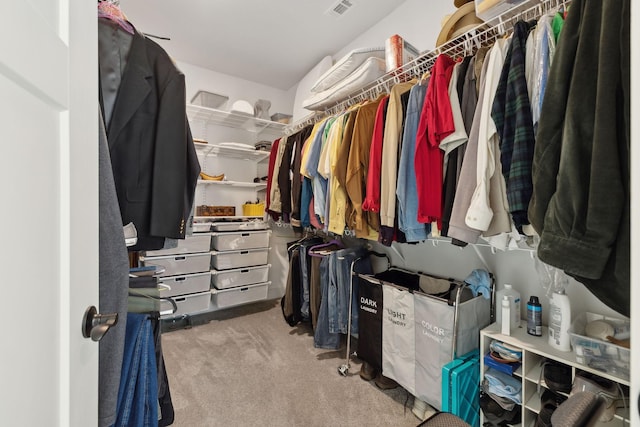 spacious closet with carpet floors and visible vents