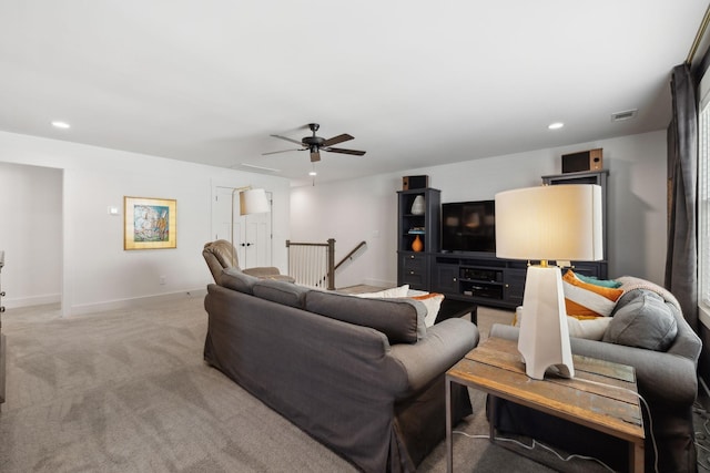 living room featuring recessed lighting, light colored carpet, visible vents, ceiling fan, and baseboards