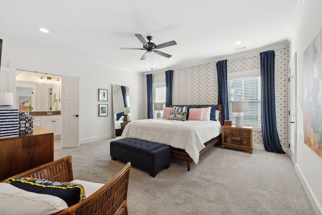 bedroom featuring light colored carpet, crown molding, visible vents, and baseboards