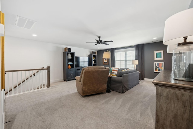 living room with recessed lighting, baseboards, a ceiling fan, and light colored carpet