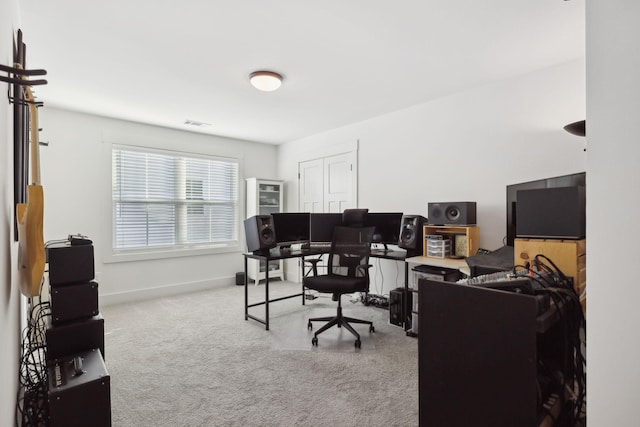 carpeted home office with visible vents and baseboards