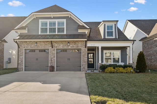 craftsman house featuring a standing seam roof, brick siding, driveway, and a front lawn