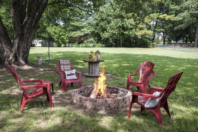 view of yard with an outdoor fire pit