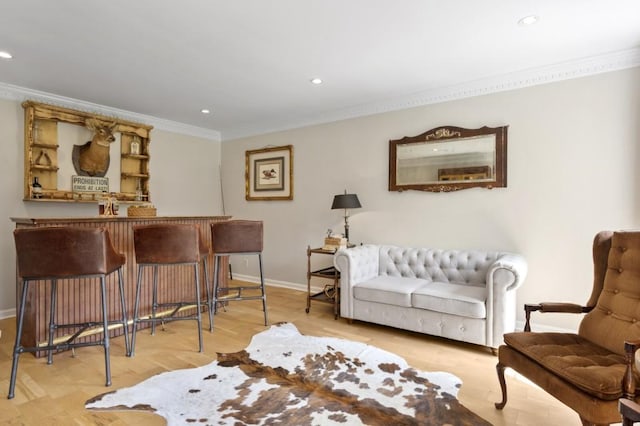 interior space featuring crown molding, recessed lighting, a bar, wood finished floors, and baseboards