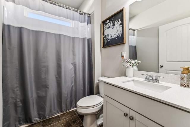 bathroom with curtained shower, vanity, and toilet