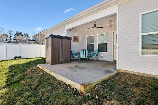 view of patio with ceiling fan and fence