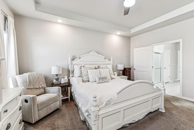 bedroom featuring a raised ceiling, dark colored carpet, a ceiling fan, and recessed lighting