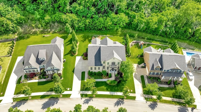 birds eye view of property with a residential view