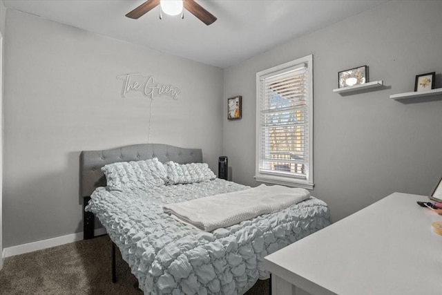 carpeted bedroom featuring ceiling fan and baseboards