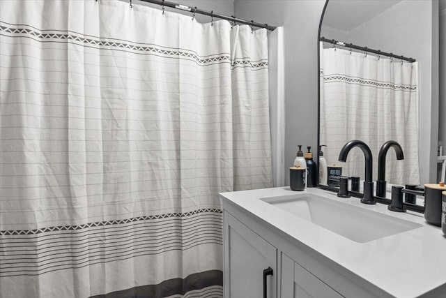 bathroom featuring vanity and a shower with curtain