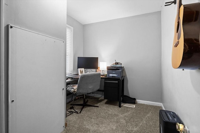 carpeted office space featuring baseboards