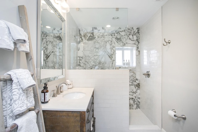 bathroom featuring vanity and a walk in shower