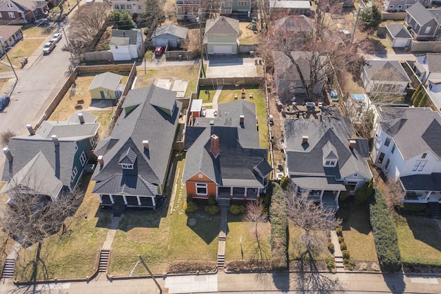 birds eye view of property with a residential view