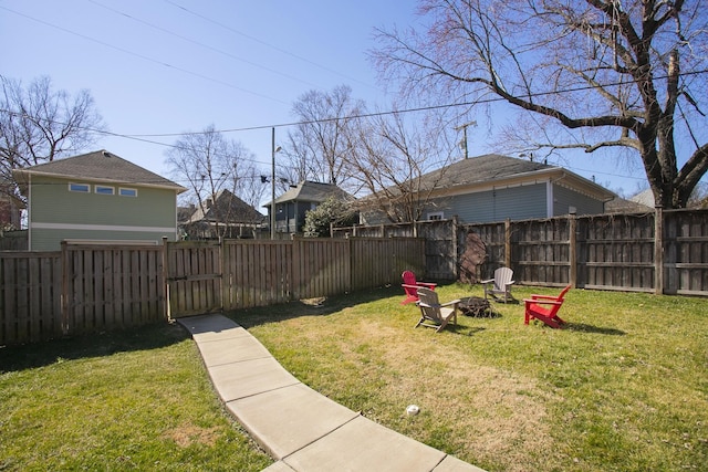 view of yard with an outdoor fire pit and a fenced backyard