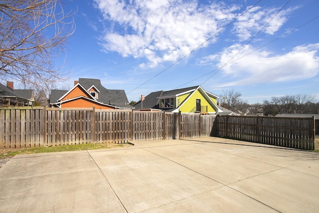 view of patio featuring a fenced front yard and a gate