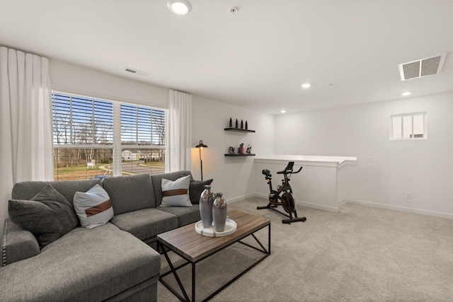 living room featuring baseboards, recessed lighting, visible vents, and light colored carpet