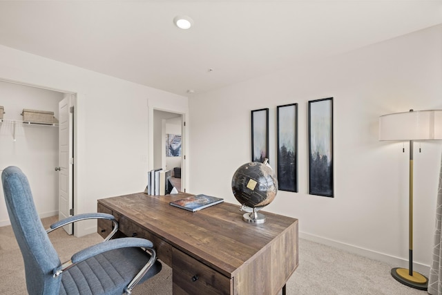 carpeted office with baseboards