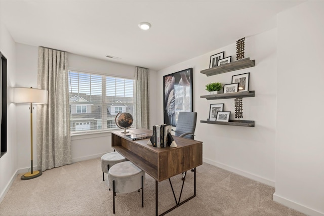 home office with carpet floors, visible vents, and baseboards