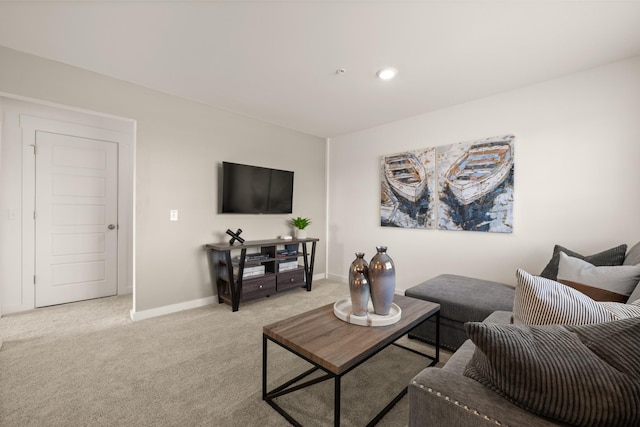 living room with recessed lighting, baseboards, and light colored carpet