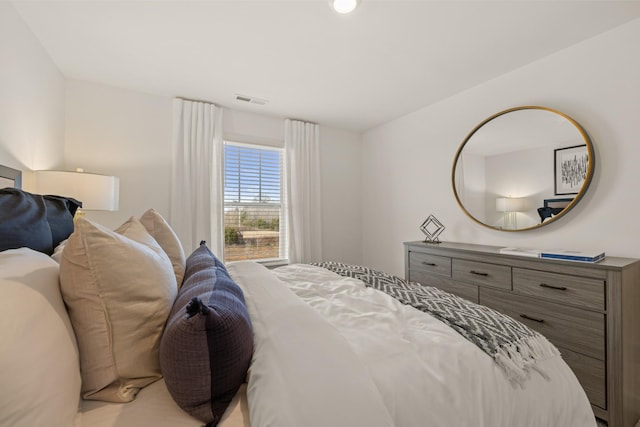 bedroom featuring visible vents