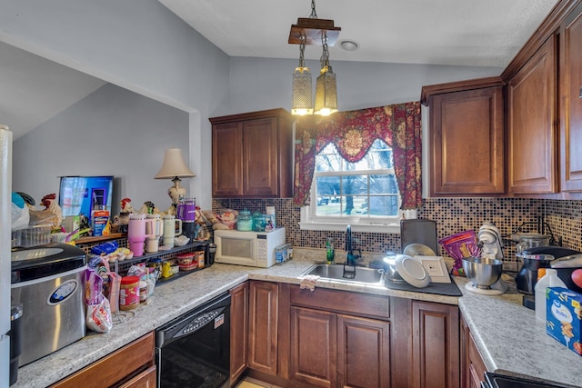 kitchen with black dishwasher, white microwave, a sink, and lofted ceiling