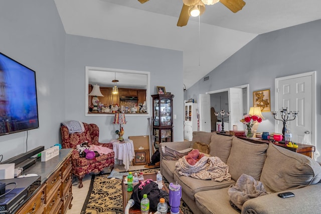 living room with lofted ceiling and a ceiling fan