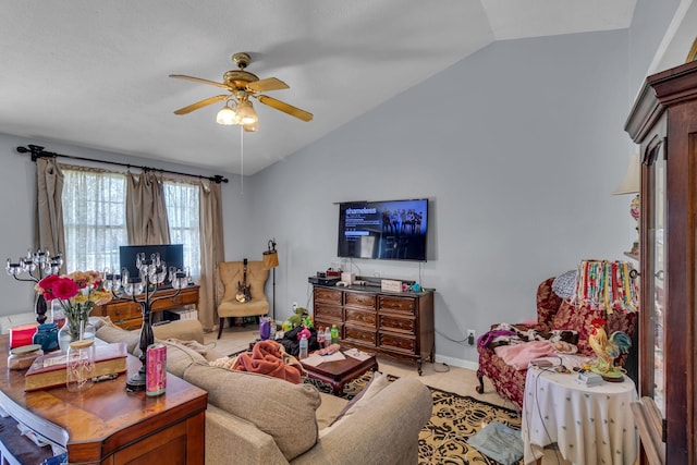 living room featuring light tile patterned floors, ceiling fan, baseboards, and vaulted ceiling