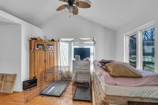 bedroom featuring lofted ceiling and light wood finished floors