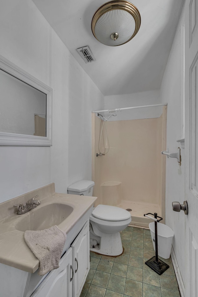 bathroom with a stall shower, visible vents, toilet, tile patterned flooring, and vanity