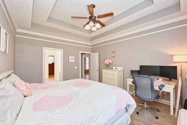 bedroom featuring carpet, a ceiling fan, a raised ceiling, and crown molding