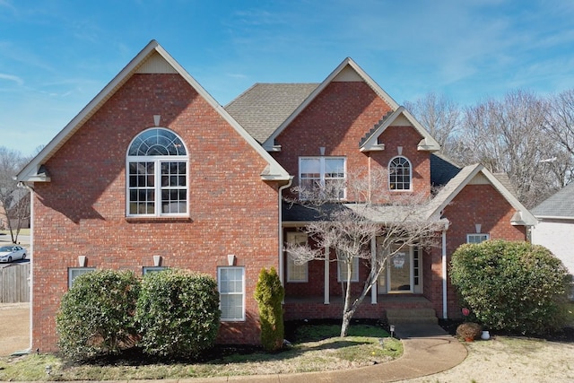 traditional-style house featuring brick siding