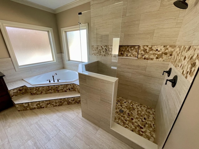 bathroom with ornamental molding, a garden tub, and walk in shower