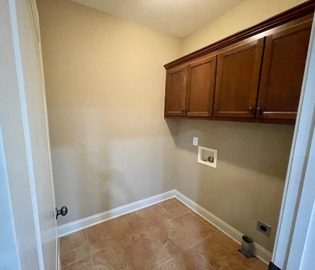 washroom with cabinet space, hookup for a washing machine, baseboards, and hookup for an electric dryer