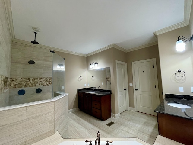 bathroom featuring ornamental molding, two vanities, a sink, and a walk in shower