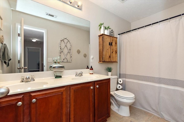 full bathroom with toilet, a textured ceiling, visible vents, and a sink