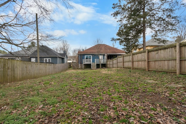 view of yard featuring a fenced backyard