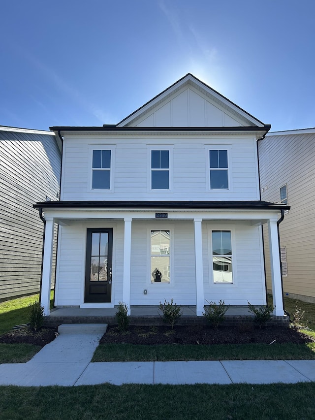 view of front facade featuring board and batten siding and covered porch