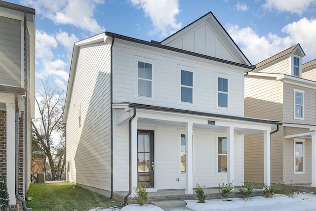 view of front of house with central air condition unit, a porch, and board and batten siding