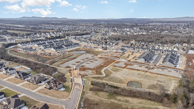 drone / aerial view featuring a residential view and a mountain view