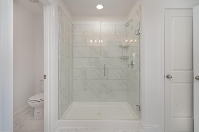 full bathroom featuring toilet, marble finish floor, a shower stall, and baseboards