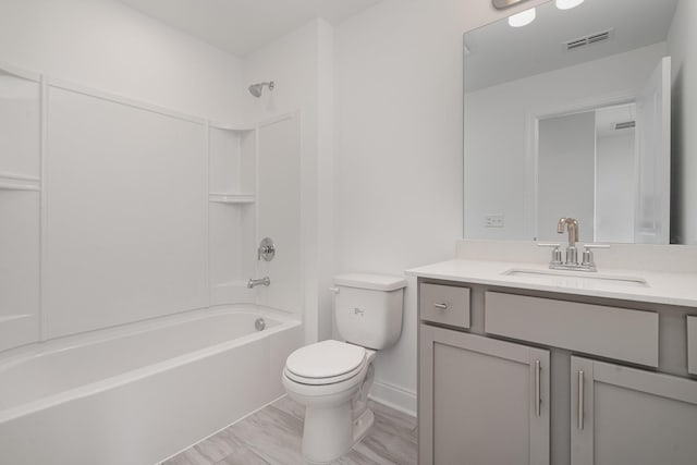 full bathroom featuring toilet, visible vents, shower / bathing tub combination, and vanity