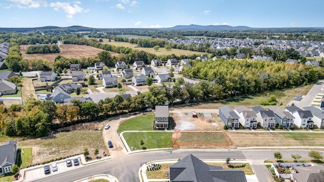 birds eye view of property featuring a mountain view and a residential view