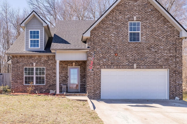 view of front of house featuring a front yard, roof with shingles, and driveway