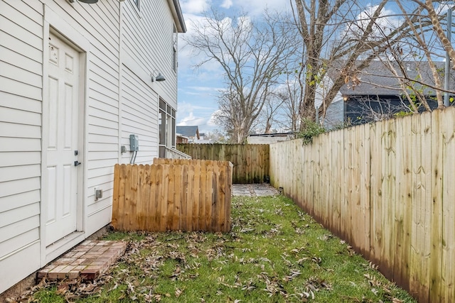 view of yard with a fenced backyard