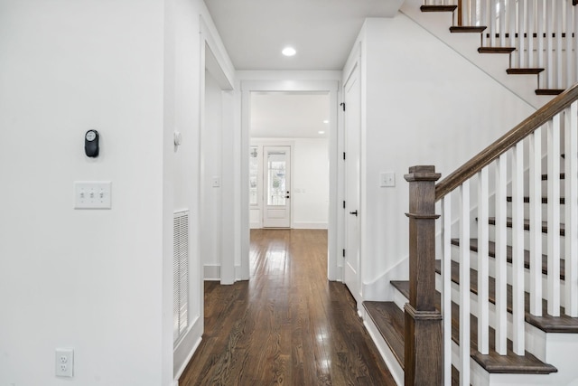 hall featuring stairs, baseboards, dark wood finished floors, and recessed lighting