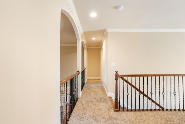 hallway featuring baseboards, ornamental molding, carpet, and recessed lighting